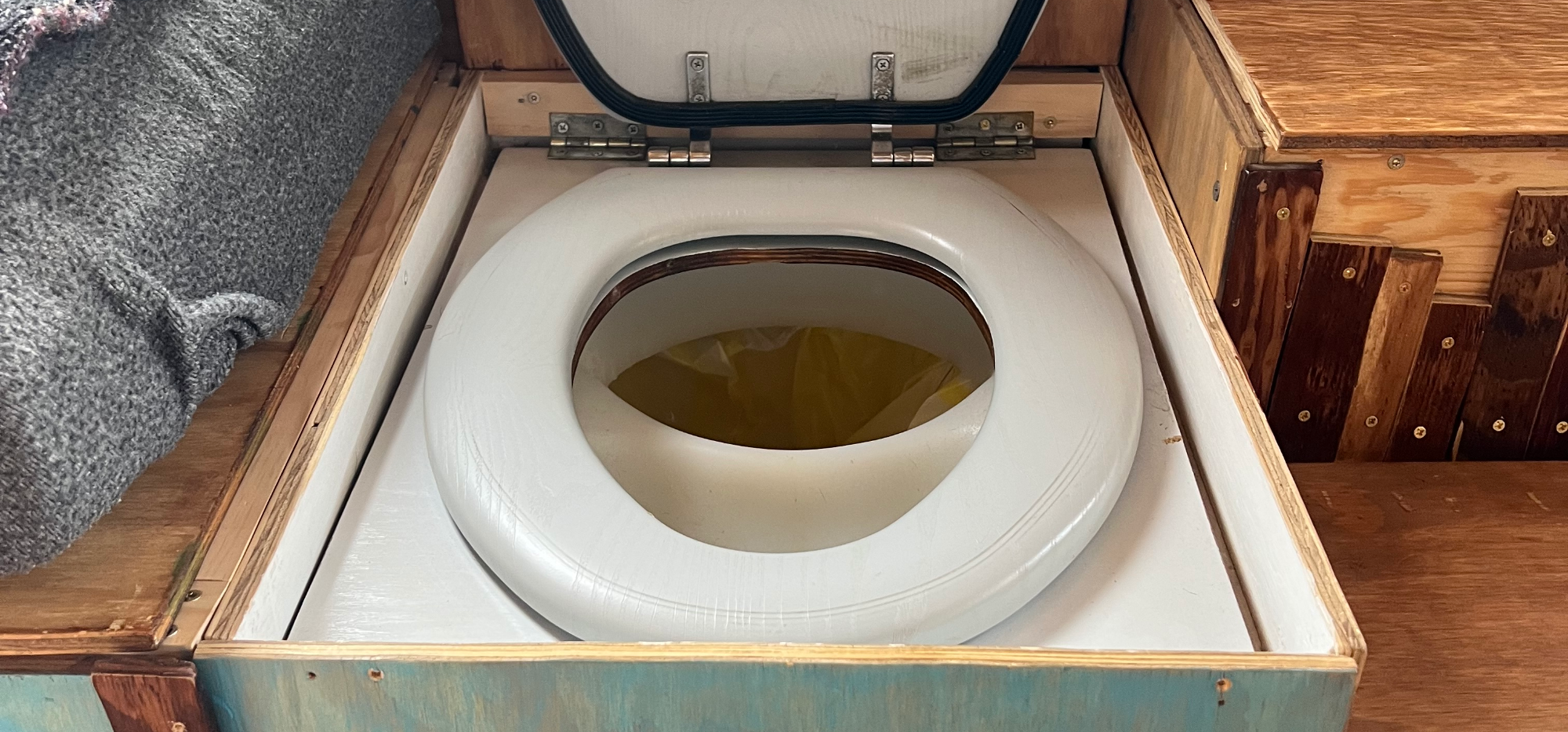 Hidden DIY Throne in a Skoolie